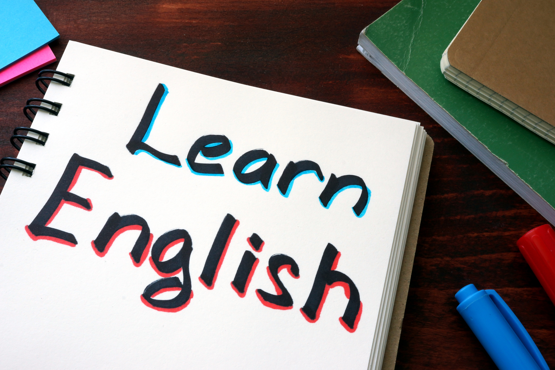 Learn English written on a notepad with marker.